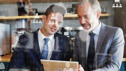 Poster - Network of profile icons against caucasian senior and young businessman using digital tablet