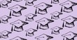 Composition of multiple graduation hats on purple background