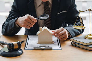 Attorney or judge sitting at  desk, holding magnifying glass and reading book. Businessman, business auditor, teacher, professor searching for information, fact-checking, law consulting professional