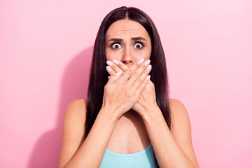 Poster - Photo portrait of brunette amazed covered mouth with hands keeping secret isolated on pastel pink color background