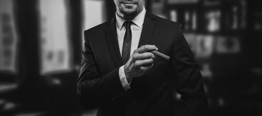 image of an adult stylish man in a suit with a cigar. cigar clubs concept.