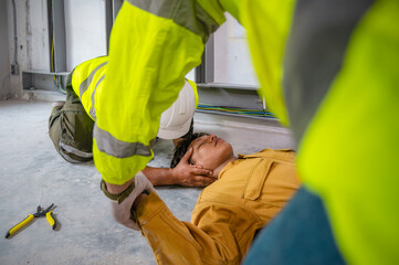 Electric worker suffered an electric shock accident unconscious. Safety team CPR for first aid Electric worker loses in electric shock accident at work on site. Accident in control room of factory.