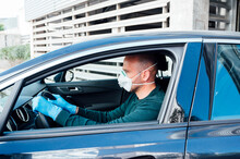 Bald Man With Protective Mask Inside A Car
