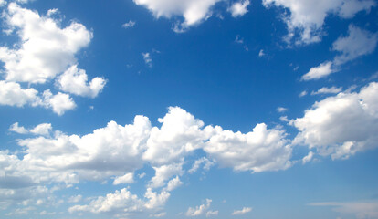 blue sky background with tiny clouds