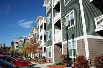 apartment building with autumn trees landscape