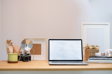 Wall Mural - Modern workspace with computer with blank screen and equipment on white table.Blank screen for your information.