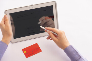 A human hand making a digital transaction with credit card.