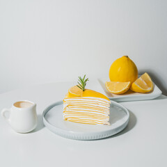 Sticker - Lemon Cake on white table Food and dessert concept.