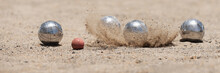 Petanque Ball Boules Bowls On A Dust Floor, Photo In Impact. Balls And A Small Wood Jack