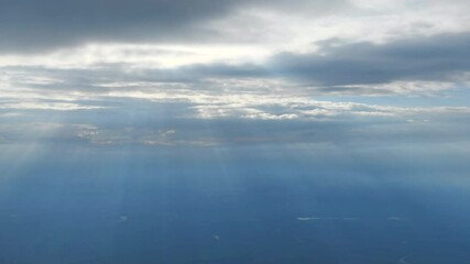 Wall Mural - Sun rays above the earth, aerial view