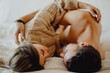 © ADDICTIVE STOCK - Happy couple hugging on bed
