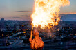 © ADDICTIVE STOCK - Fire-eater artist performing spit fire at sunset