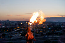 Fire-eater Artist Performing Spit Fire At Sunset