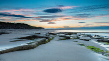View Of Cresswell Beach On The Coast Of Northumberland, England, UK, At Sunset.
