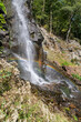 A rainbow over the stream of a waterfall
