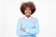© Damir Khabirov - Pretty smiling african american teen girl, high school or college student standing with crossed arms, isolated on gray background