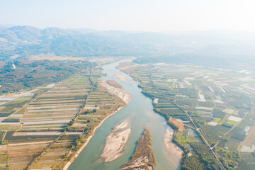 aerial view of a village field and river