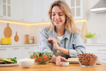 Poster - Woman at wooden table with healthy food in kitchen. Keto diet