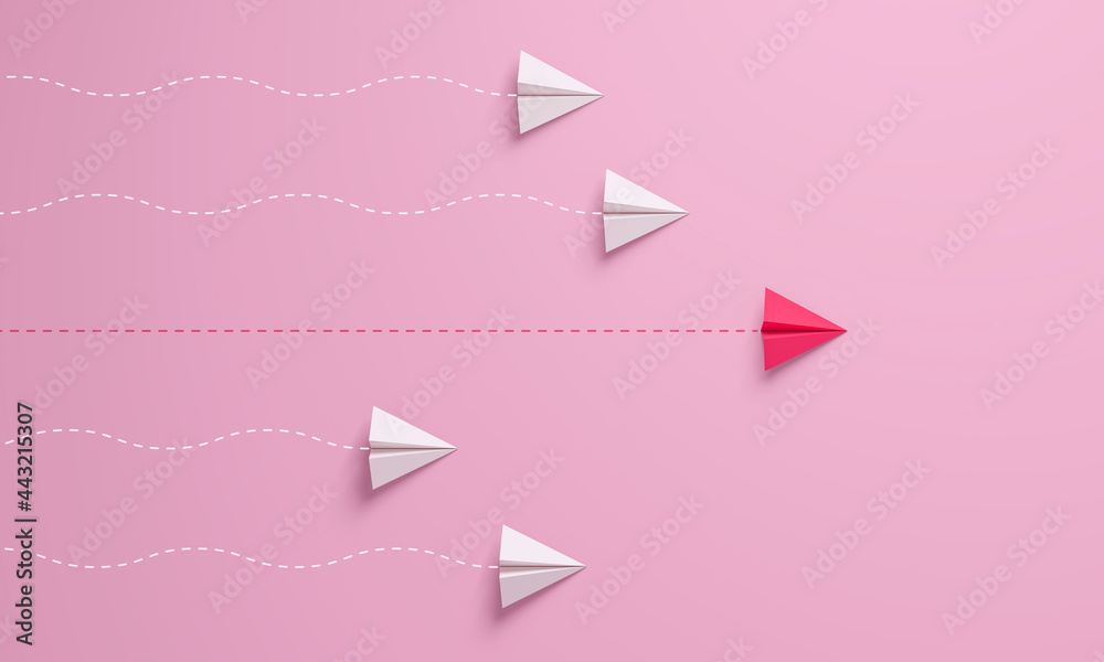 Women's leadership concepts with red paper airplane leading among white on pink background. - obrazy, fototapety, plakaty 