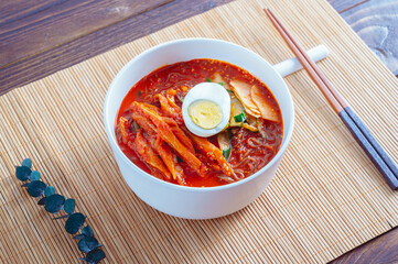 spicy buckwheat noodles with marinated dried pollack, Korean food 'kodari naengmyeon'