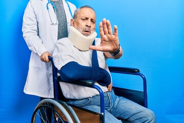 Sticker - Handsome senior man with beard sitting on wheelchair with neck collar doing stop gesture with hands palms, angry and frustration expression