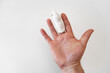 © Maria - orthosis for fixing the finger on hand on a white background