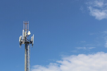 A tower for transmitting radio waves against a blue sky