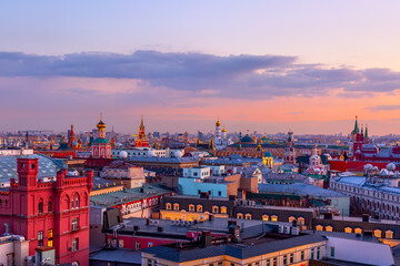 Wall Mural - Aerial sunset view of the center of Moscow with Kremlin tower and other buildings. World famous Moscow landmarks for tourism and travel.