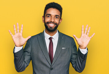 Canvas Print - Young african american man wearing business clothes showing and pointing up with fingers number ten while smiling confident and happy.