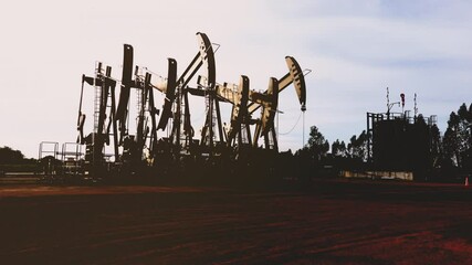 Wall Mural - Oil extracting by pump jack in the oil field