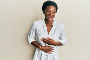 Poster - Young african american girl wearing casual clothes smiling and laughing hard out loud because funny crazy joke with hands on body.