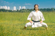 teen girl practicing karate kata outdoors in kiba-dachi stance