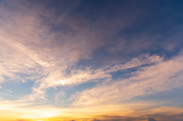 Wall Mural - sunset / sun rise sky with rays of yellow and red light shining clouds and sky background and textur