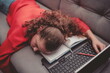 © Minet - Tired girl is sleeping next to a laptop.Tired girl from distance learning at home.Online education for kids during quarantine.