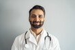 © Stock 4 You - Headshot portrait of smiling doctor looking at camera over studio background