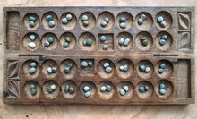 Antique Boa Mancala Tradition African Board Game. Vintage Bao Carved Wooden Board Game. With Natural Baobab Tree Seeds Balls.