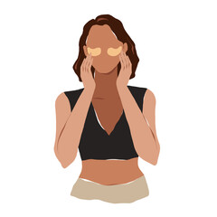 young woman applying eye patches against dark circles and puffiness under eyes, golden gel eye patch