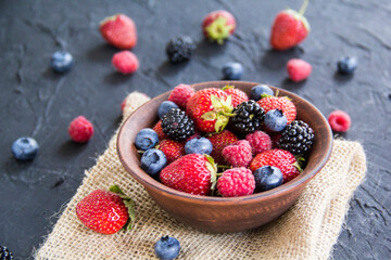 A healthy serving of fresh summer berries. Creative atmospheric decoration