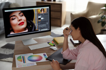 Poster - Tired retoucher at workplace with computer in office