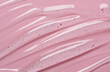 Serum texture on transparent liquid gel background with pink background.