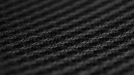 Macro fiber structure of black synthetic mesh fabric. Dolly shot