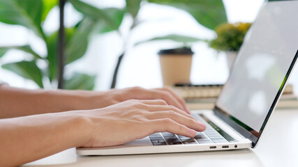 Wall Mural - laptop computer screen mockup, template background, man hand typing laptop computer with blank scree