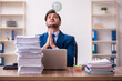© Elnur - Young businessman employee unhappy with excessive work in the office