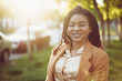 © fotofabrika - Portrait of a young black woman standing in a street