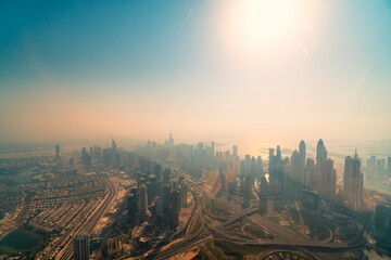 Wall Mural - Aerial view from helicopter on the Dubai Marina with modern offices and tall skyscrapers