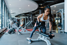 Beautiful Young Asia Lady Exercise Doing Lifting Barbell Fat Burning Workout In Fitness Class. Athlete With Six Pack, Sportswoman Recreational Activity, Functional Training, Healthy Lifestyle Concept.