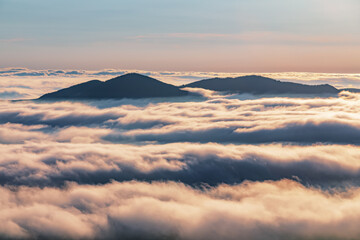 Wall Mural - Amazing foggy morning. Sunrise. Landscape with high mountains. The early morning mist. Touristic place. Natural scenery.