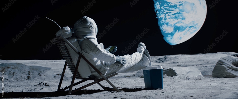 Back view of lunar astronaut opens a beer bottle while resting in a beach chair on Moon surface, enjoying view of Earth - obrazy, fototapety, plakaty 