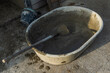 Empty mixing bucket for construction, Cement mixing equipment and wooden handle hoe steel on site