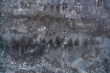 Black and gray dirty concrete wall texture background. Dark grunge concrete wall texture background. Rough cement surface abstract background. The unique crack pattern of old and dirty cement floor.